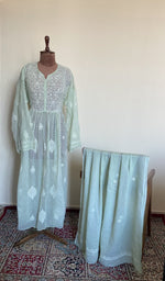 The set on the mannequin with its dupatta beside it