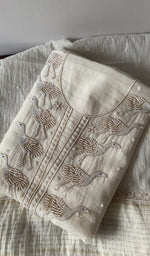 Folded kurta piece and dupatta, chikankari along the hem