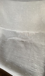 Hem and border of the white dupatta
