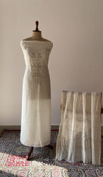 White pure mul chanderi chikankari suit set on the mannequin with its dupatta