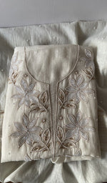 Folded kurta piece and dupatta, chikankari along the hem