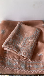 Folded peach pure organza silk kurta piece with chikankari on the panel
