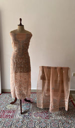 Peach pure organza silk chikankari suit set on the mannequin with its dupatta