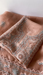 Folded kurta piece and dupatta, chikankari along the hem