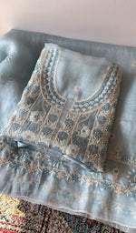 Folded blue pure organza silk kurta piece with chikankari on the panel
