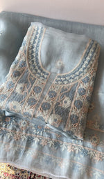 Folded kurta piece and dupatta, chikankari along the hem