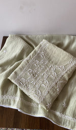 Folded green pure mul chanderi kurta piece with chikankari on the panel