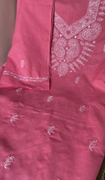 Rose pink cotton laid out flat