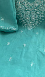 Turquoise cotton laid flat on the table