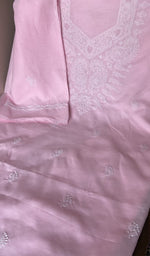 Baby pink cotton laid out flat