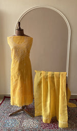 Mustard yellow cotton set on the mannequin with its dupatta