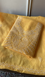 Folded mustard yellow cotton kurta, second view