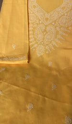 Mustard yellow cotton laid out flat
