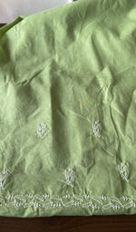 The pista green kurta, spread out flat