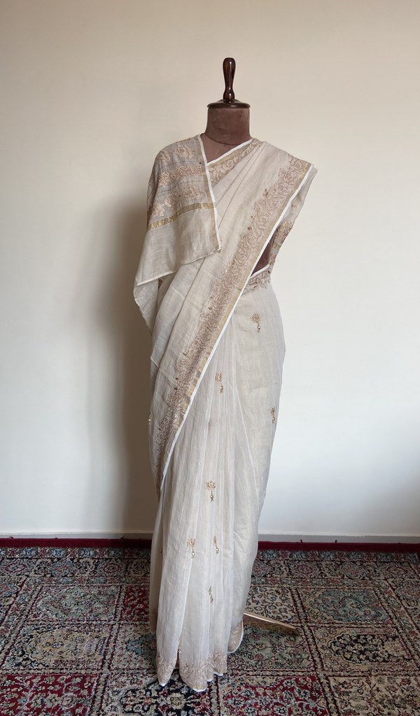 Ivory tissue chanderi saree draped on the mannequin, front view