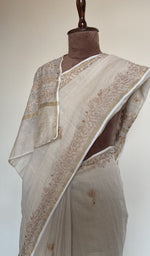 Fine do taar and teen taar resham chikankari on border on the ivory saree