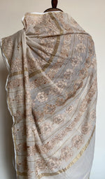 Embroidery on the ivory saree, close view