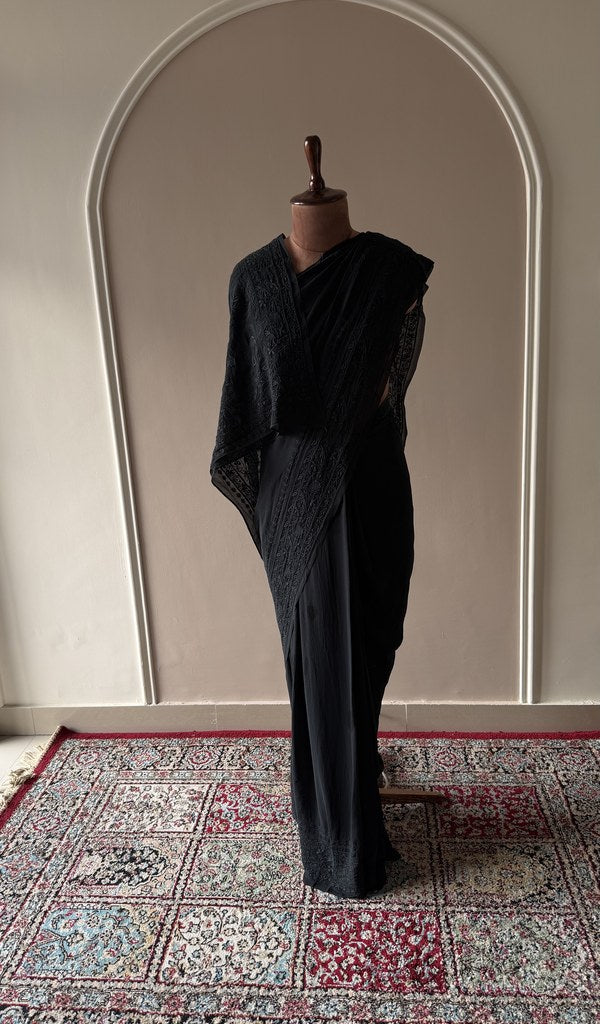 Black silk georgette saree draped on the mannequin, front view