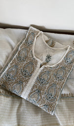 Ivory mul chanderi kurta piece folded, gala work in front