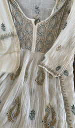Fine chikankari on gathers style on the ivory kurta