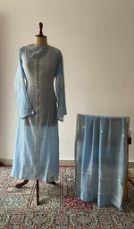 The set on the mannequin with its dupatta beside it