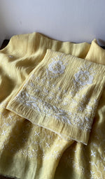 Yellow pure mul chanderi kurta piece folded, fine do taar and teen taar chikankari on motifs and daman