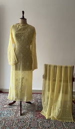 The set on the mannequin with its dupatta beside it