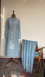 The set on the mannequin with its dupatta beside it