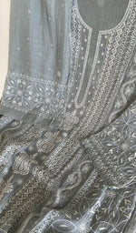 Motifs across the body of the grey kurta