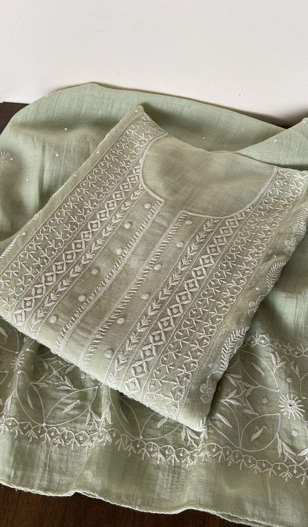 Green pure mul chanderi kurta piece folded, fine do taar and teen taar front jaal chikankari