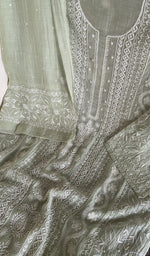 Motifs across the body of the green kurta