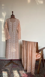 The set on the mannequin with its dupatta beside it