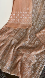 Motifs across the body of the peach kurta