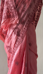Coral pink saree on the mannequin, close view