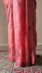 Fine chikankari on border and palla on the coral pink saree