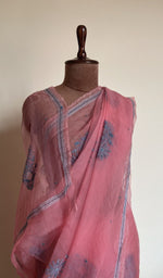 Coral pink saree on the mannequin, close view