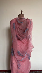 Embroidery on the coral pink saree, close view