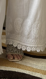 Hem embroidery on the white palazzo, up close