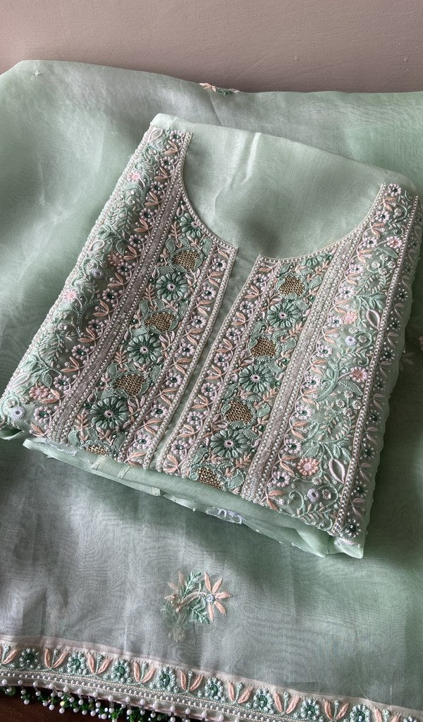 Folded mint green organza silk kurta, front view