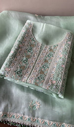 Folded mint green organza silk kurta, front view