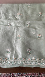 The mint green kurta, spread out flat