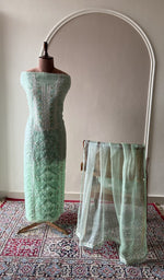Mint green organza silk set on the mannequin with its dupatta