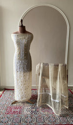 Cream organza silk set on the mannequin with its dupatta