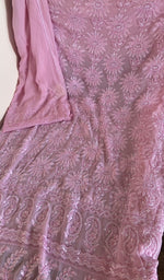 Pink silk georgette laid flat on the table