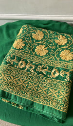 green cotton kurta piece folded, fine jaaldar chikankari