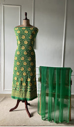 The set on the mannequin with its dupatta beside it