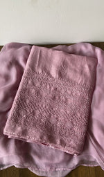 Pink raw silk kurta piece folded, fine chikankari