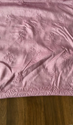 The kurta piece folded on the carpet