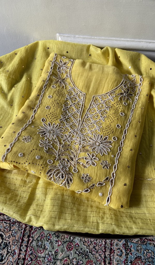Yellow pure mul chanderi kurta piece folded, beads badla work and mukaish work in view