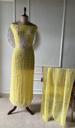 Yellow suit set on the mannequin with its dupatta